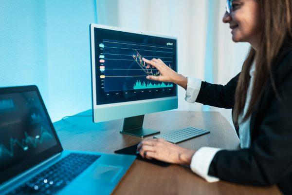 Financial analyst working on stock exchange market in modern office - Fintech concept